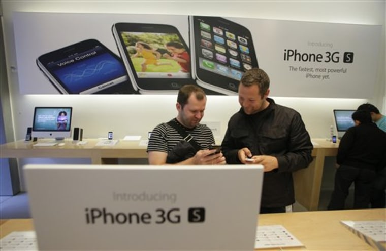 Customers look over the new Apple iPhone 3G S at the Apple store in San Francisco. It's been three years, an eternity for gadgets, since Apple Inc. unveiled the iPhone, and by now other phones do some things better. 